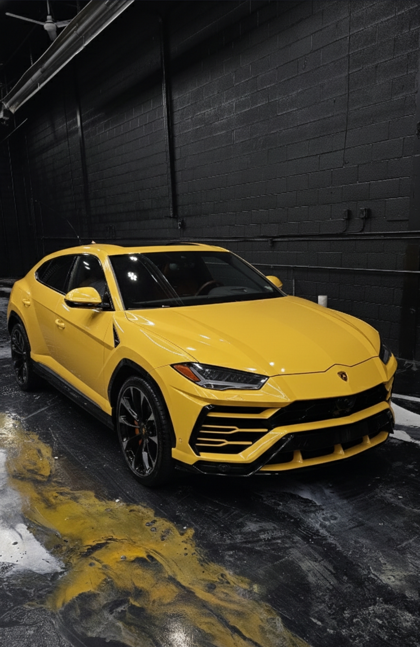Yellow Lamborghini Urus parked in the Jester Werks Mississauga ceramic coating studio after a 2-layer Crystal Serum Light + EXO v5 application